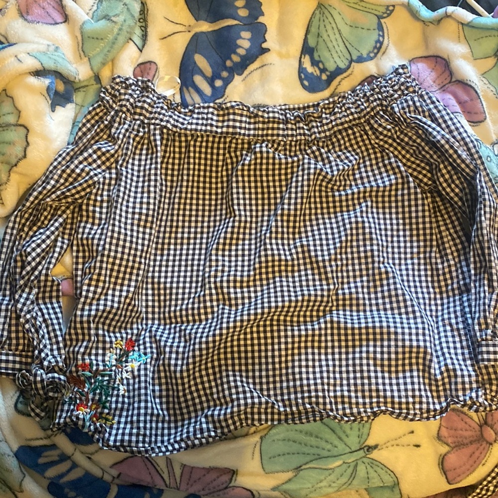 It’s From Passport. it’s Plaid Print. Its Size L for Girls.